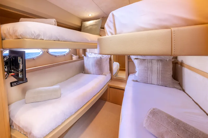 P'tite Bouille Yacht Photos Pics Luxurious cabin interior of 2008 Princess V70 yacht with cozy bunk beds.