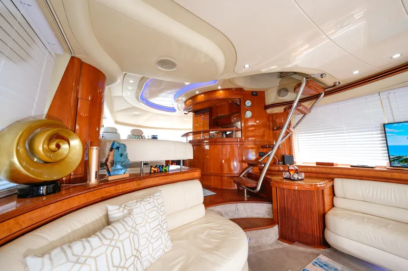 Finesse Yacht Photos Pics Luxurious interior of a 2007 Azimut 68E yacht with elegant wood finishes and modern decor.