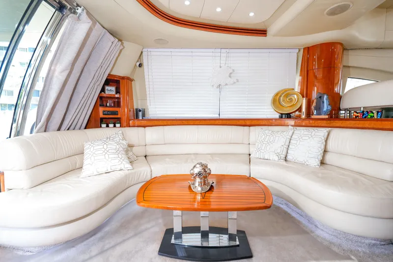 Finesse Yacht Photos Pics Luxurious interior of a 2007 Azimut 68E yacht with elegant white seating and wooden accents.