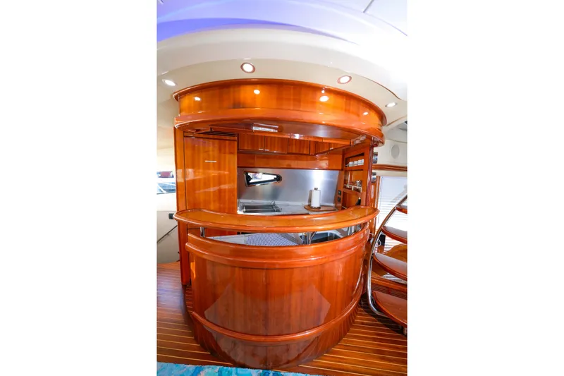 Finesse Yacht Photos Pics Luxurious wooden interior of 2007 Azimut 68E yacht kitchen area.