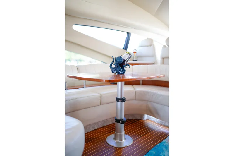Finesse Yacht Photos Pics Luxurious interior of 2007 Azimut 68E yacht with elegant seating and table.