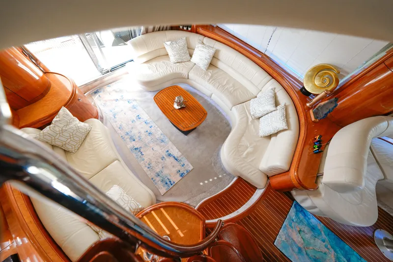 Finesse Yacht Photos Pics Luxurious interior of 2007 Azimut 68E yacht with elegant white seating and wooden accents.