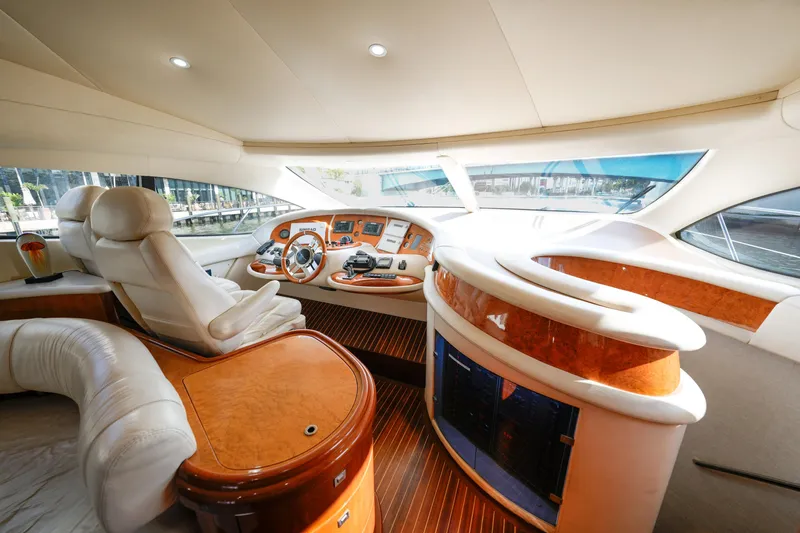 Finesse Yacht Photos Pics Luxurious interior of a 2007 Azimut 68E yacht with elegant wood and leather finishes.