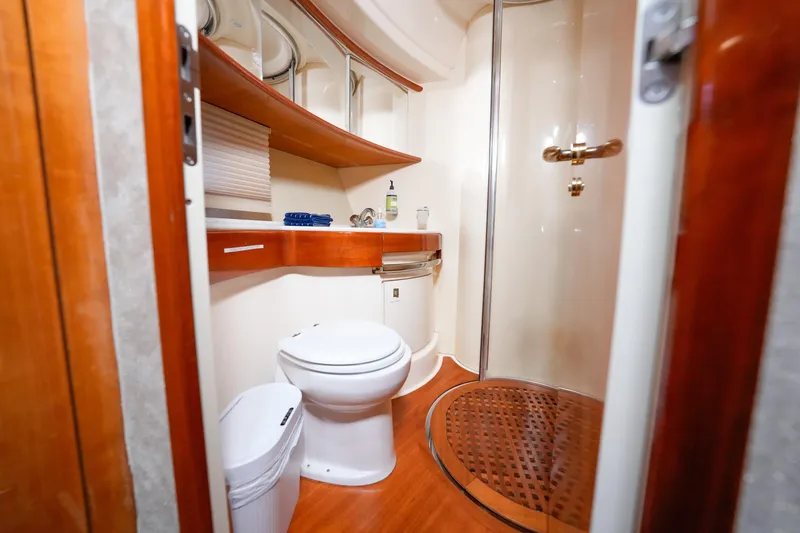 Finesse Yacht Photos Pics Luxurious bathroom in 2007 Azimut 68E yacht with modern fixtures and wooden accents.