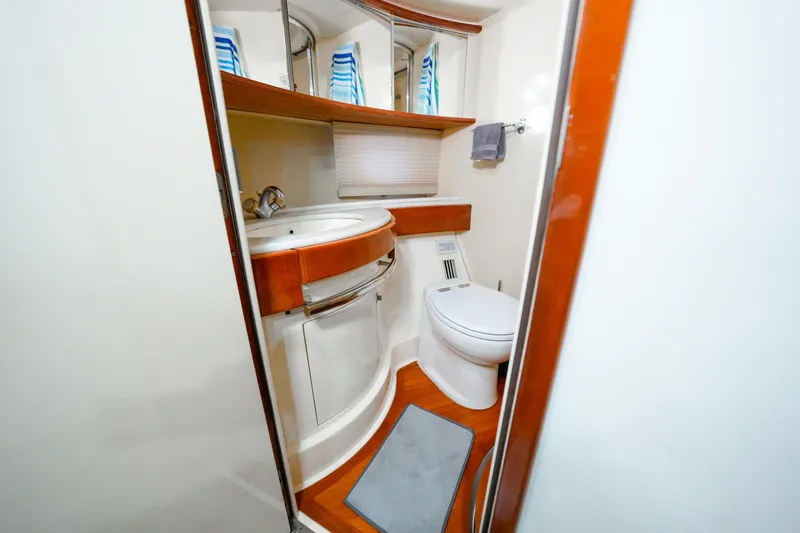 Finesse Yacht Photos Pics Luxurious bathroom in 2007 Azimut 68E yacht with modern fixtures and elegant design.