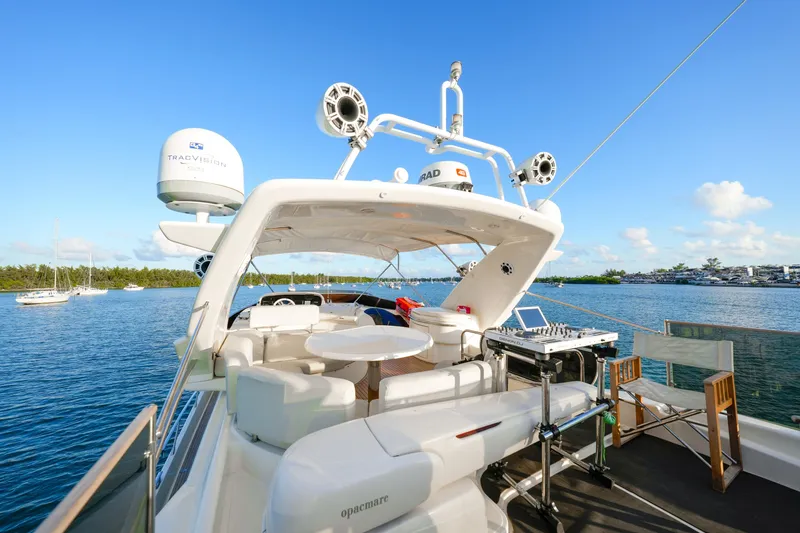 Finesse Yacht Photos Pics Luxurious 2007 Azimut 68E yacht with spacious deck and modern amenities on serene water.