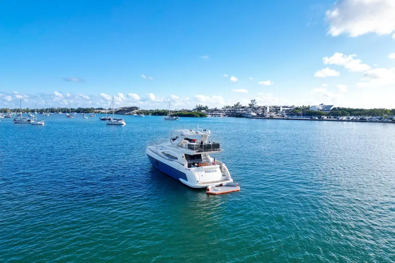 Finesse Yacht Photos Pics 2007 Azimut 68E yacht on serene blue waters under a clear sky.