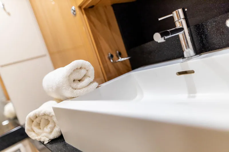  Yacht Photos Pics Modern bathroom sink with rolled towels on a Hanse 630e yacht, 2013 model.