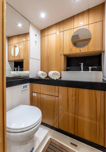  Yacht Photos Pics Luxurious bathroom in 2013 Hanse 630e yacht with wooden cabinetry and modern fixtures.