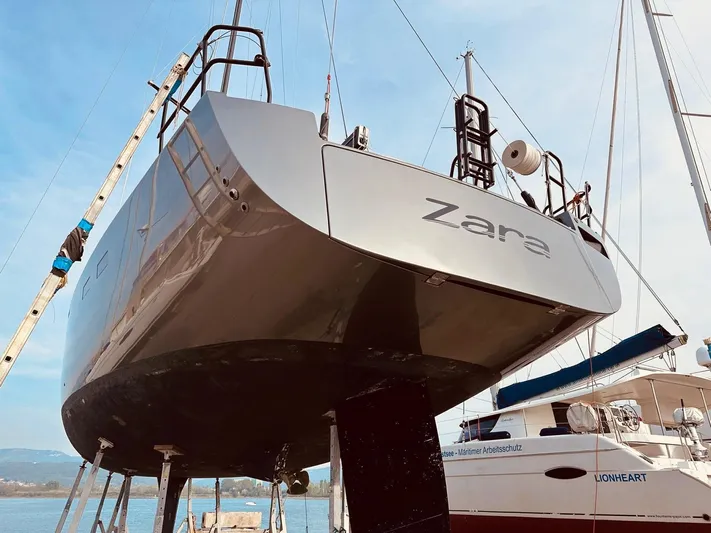  Yacht Photos Pics Hanse 630e yacht from 2013 named Zara, docked with clear blue sky.