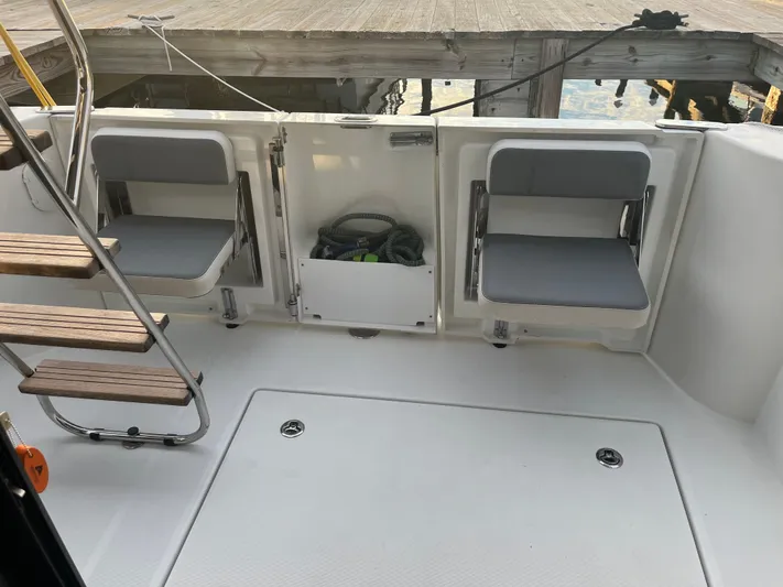 Isabelle Yacht Photos Pics Aft area of 2016 Beneteau Swift Trawler 30 with foldable seats.