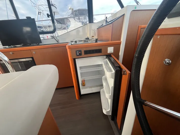 Isabelle Yacht Photos Pics Interior of Beneteau Swift Trawler 30 with open fridge.