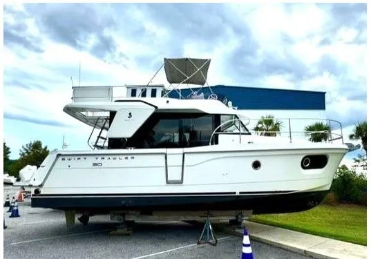 Isabelle Yacht Photos Pics 2016 Beneteau Swift Trawler 30 on a parking lot.