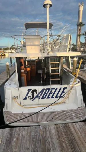 Isabelle Yacht Photos Pics Beneteau Swift Trawler 30, 2016, docked with "Isabelle" lettering.