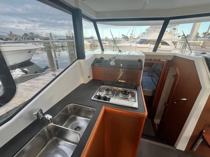 Isabelle Yacht Photos Pics Interior of Beneteau Swift Trawler 30, kitchen with stove and sink.