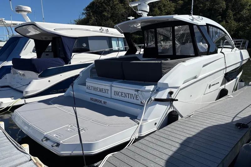  Yacht Photos Pics 2021 Cruisers Yachts 390 Express Coupe docked, labeled "Retirement Incentive," Holbrook, NY.