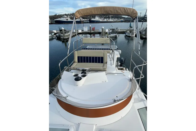 Poseidon&rsquo;s Lanai Yacht Photos Pics 2021 Ranger Tugs R-29 CB boat with flybridge, docked in a marina.
