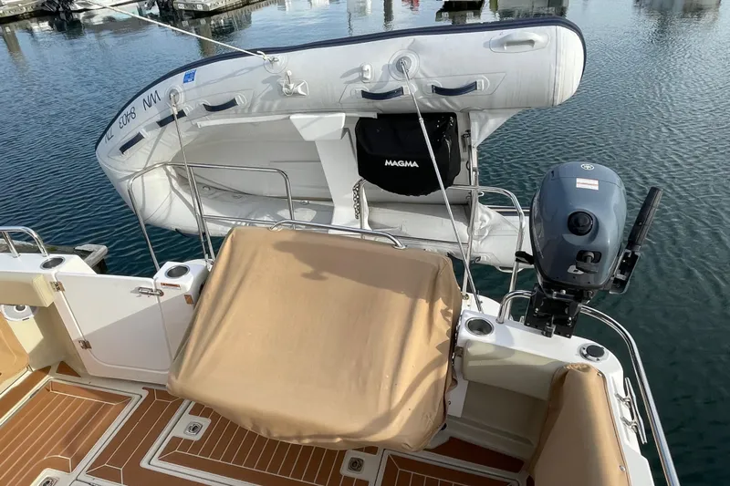 Poseidon&rsquo;s Lanai Yacht Photos Pics 2021 Ranger Tugs R-29 CB boat with dinghy and outboard motor on deck.