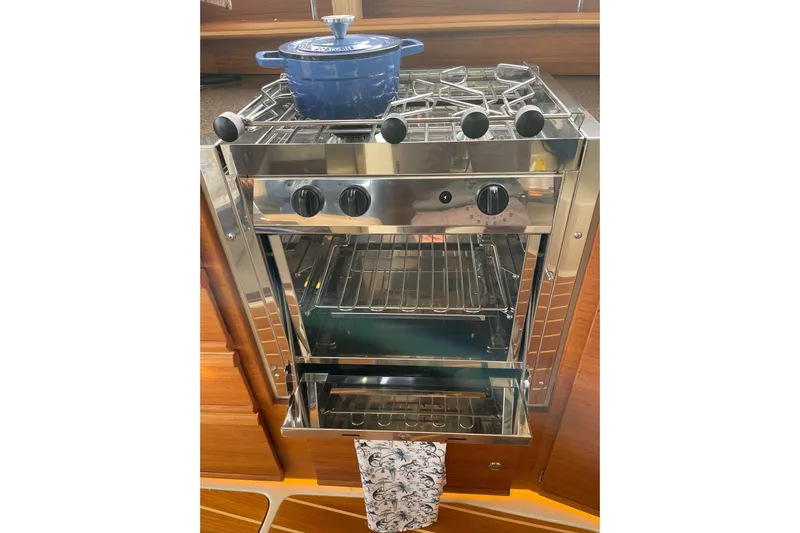 Poseidon&rsquo;s Lanai Yacht Photos Pics Stainless steel stove and oven in 2021 Ranger Tugs R-29 CB boat kitchen.