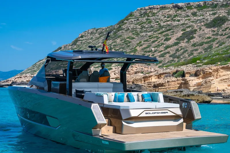  Yacht Photos Pics Luxury Tesoro GOLDFINGER T50 yacht by Armani, 2025, cruising in clear blue waters.