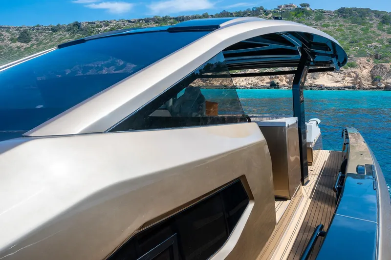  Yacht Photos Pics Luxury Tesoro GOLDFINGER T50 yacht by Armani, 2025, docked in scenic coastal waters.