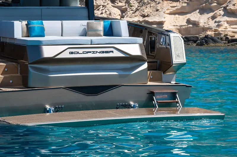  Yacht Photos Pics Luxury yacht Tesoro GOLDFINGER T50 Speciale by Armani, 2025, in clear blue waters.