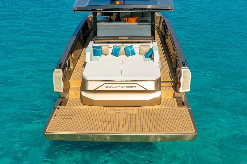  Yacht Photos Pics Luxury Tesoro GOLDFINGER T50 yacht by Armani, 2025, on clear turquoise water.