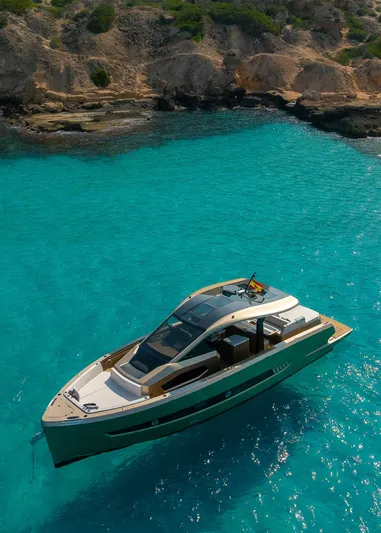  Yacht Photos Pics Luxury Tesoro GOLDFINGER T50 yacht by Armani, 2025, in clear turquoise waters.