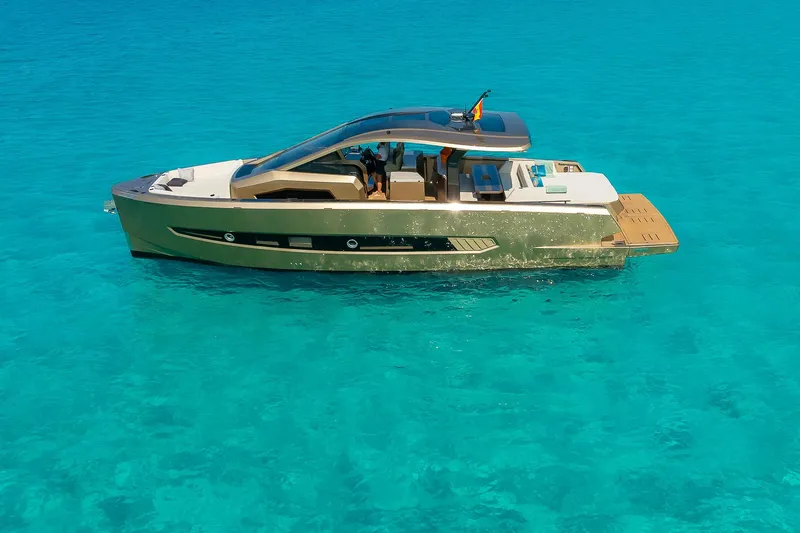  Yacht Photos Pics Luxury Tesoro GOLDFINGER T50 yacht by Armani, 2025, on clear turquoise water.