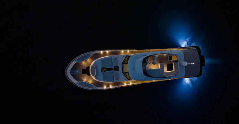 Monachus 70 Fly Yacht Photos Pics Aerial view of 2026 Monachus 70 Fly yacht illuminated at night.