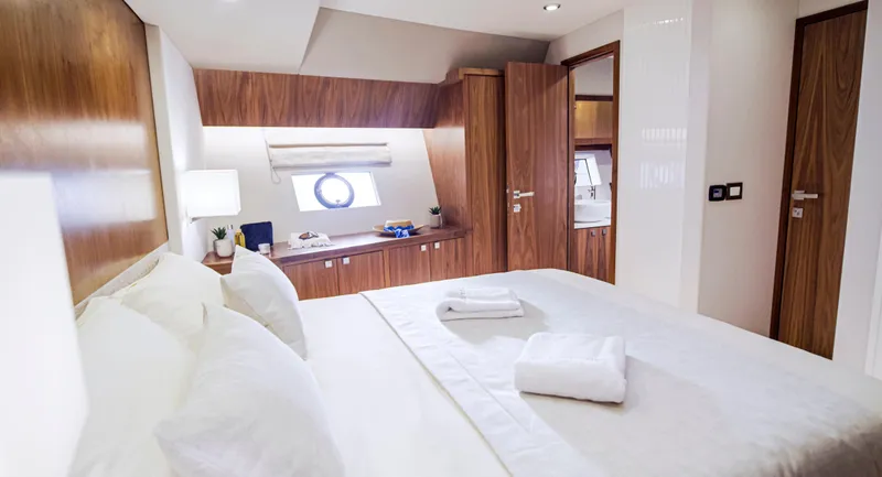 Monachus 70 Fly Yacht Photos Pics Luxurious bedroom interior of 2026 Monachus 70 Fly yacht with modern wood finishes.