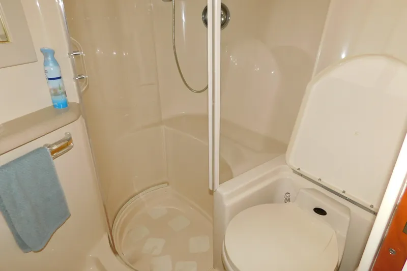  Yacht Photos Pics Bathroom interior of 1998 Sea Ray 540 Sundancer yacht with shower and toilet.