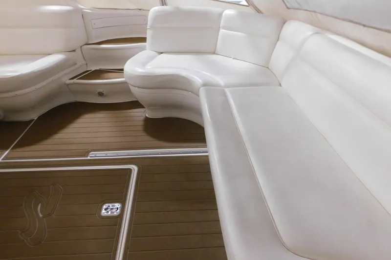  Yacht Photos Pics Luxurious white seating on 1998 Sea Ray 540 Sundancer yacht with wooden flooring.
