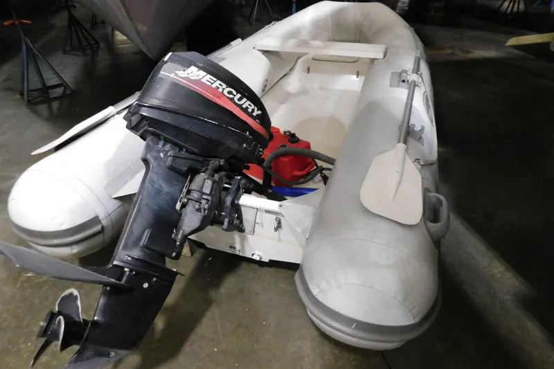  Yacht Photos Pics Inflatable boat with Mercury outboard motor, associated with 1998 Sea Ray 540 Sundancer.