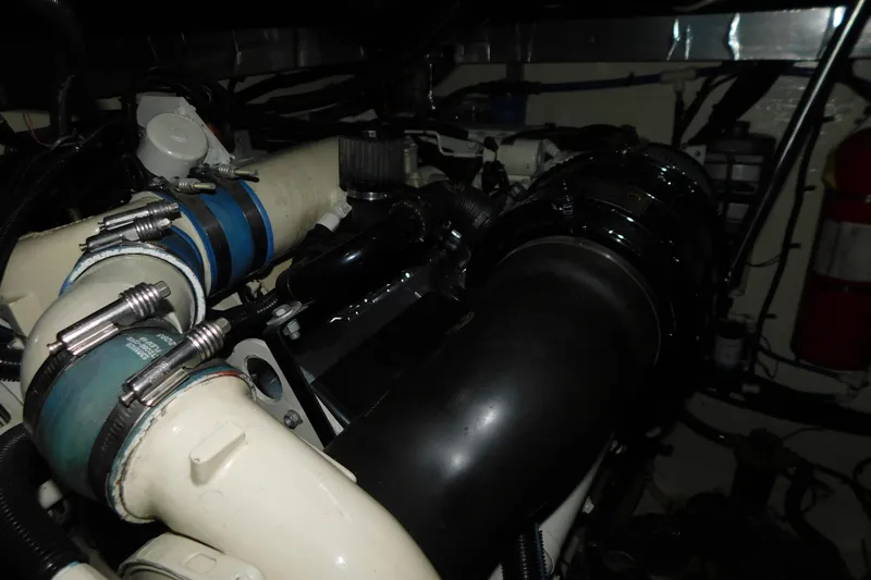  Yacht Photos Pics Engine compartment of a 1998 Sea Ray 540 Sundancer with visible hoses and components.