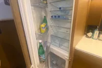 Open refrigerator inside 2016 Princess V48 Open yacht, stocked with drinks and essentials.