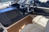 Helm of 2016 Princess V48 Open yacht with modern controls and leather seating.