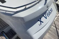 Sleek 2016 Princess V48 Open yacht with "Vision" branding on the stern.