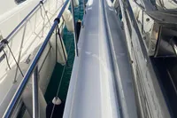 2016 Princess V48 Open yacht docked among other boats in a marina.