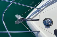 Anchor and deck of 2016 Princess V48 Open yacht in clear water.