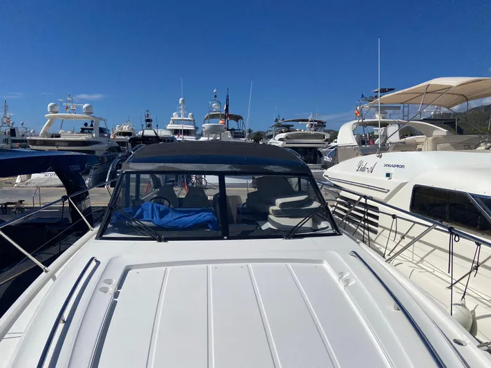  Yacht Photos Pics 2016 Princess V48 Open yacht docked among other luxury boats.
