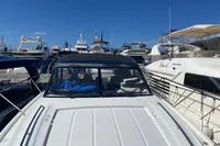 2016 Princess V48 Open yacht docked among other luxury boats.