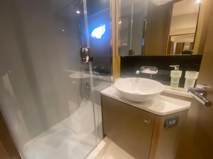  Yacht Photos Pics Luxurious bathroom in 2016 Princess V48 Open yacht with modern sink and glass shower.
