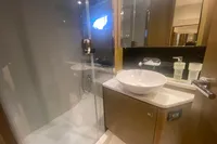 Luxurious bathroom in 2016 Princess V48 Open yacht with modern sink and glass shower.