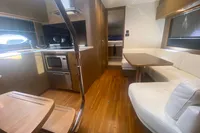 Luxurious interior of 2016 Princess V48 Open yacht with modern kitchen and seating area.