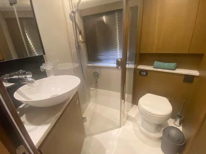  Yacht Photos Pics Luxurious bathroom in 2016 Princess V48 Open yacht with modern fixtures and elegant design.