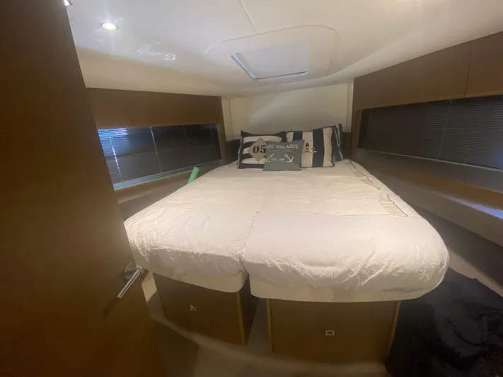  Yacht Photos Pics Luxurious bedroom interior of 2016 Princess V48 Open yacht with cozy bedding.