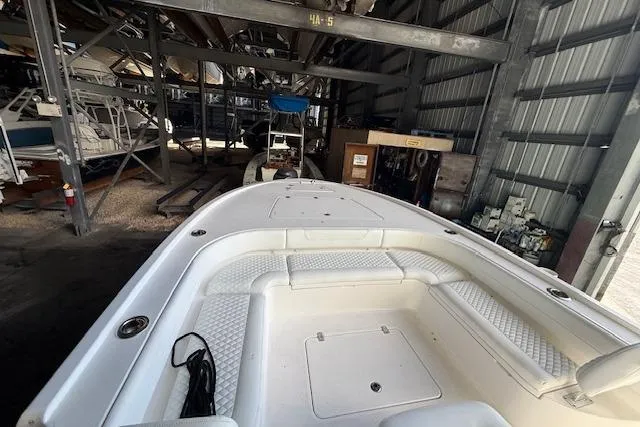  Yacht Photos Pics 2025 Caymas 28 HB boat in storage, featuring spacious white seating area.