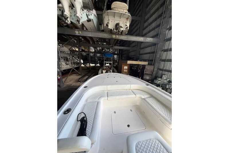  Yacht Photos Pics 2025 Caymas 28 HB boat in storage, showcasing spacious deck and seating.