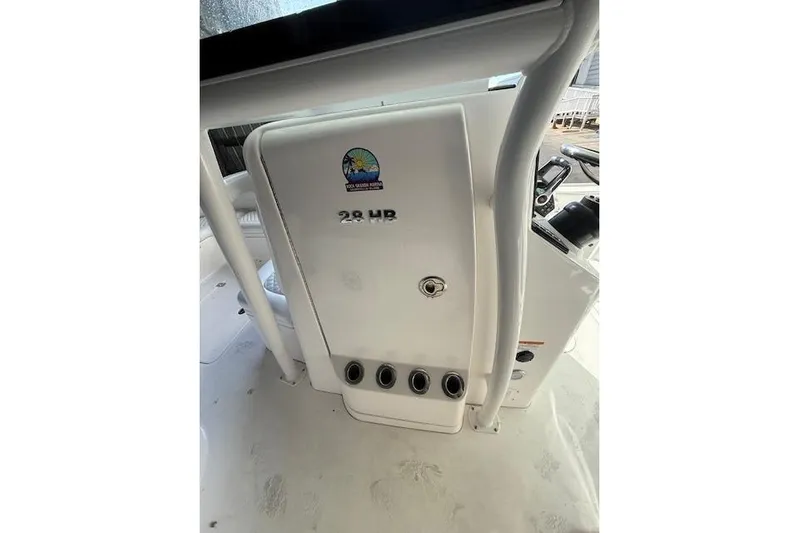  Yacht Photos Pics 2025 Caymas 28 HB boat console with logo and controls.